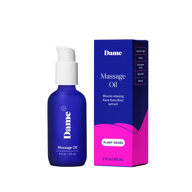Blue 2 oz Dame Sex Oil pump bottle beside retail box