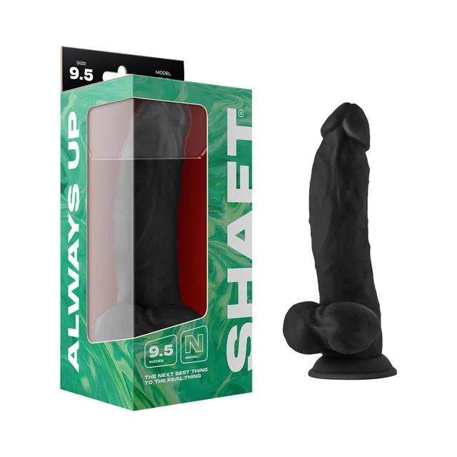 Shaft Model N 9.5-inch black dong beside green retail box