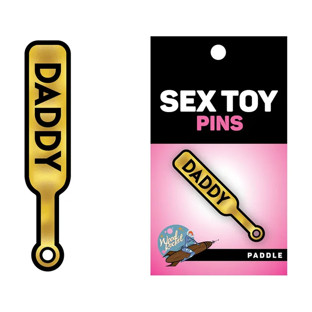 Daddy Paddle gold and black enamel pin on retail card