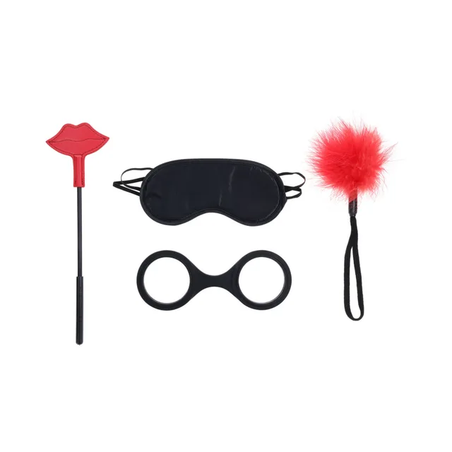 Four-piece Kiss Kit arranged with black blindfold and cuffs, red crop and feather