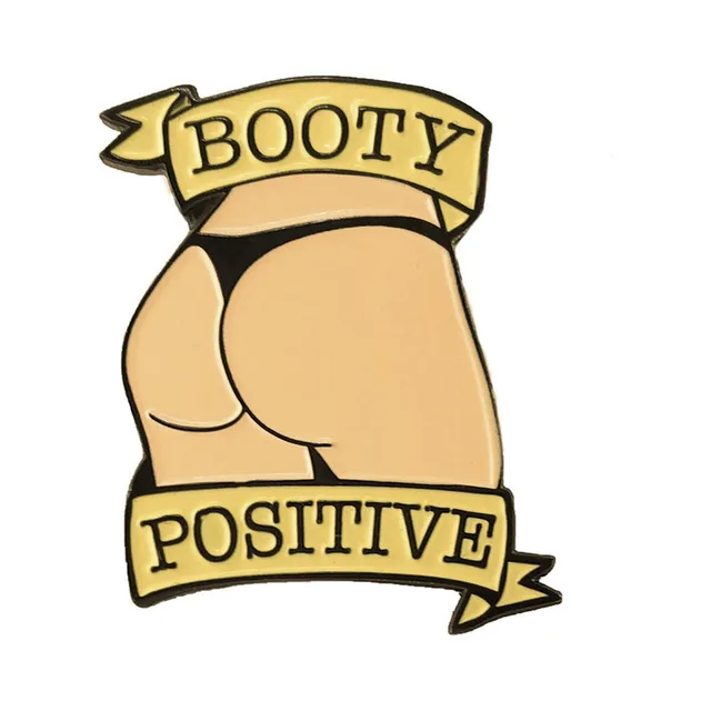 vanilla beige Booty Positive enamel pin with gold banner lettering