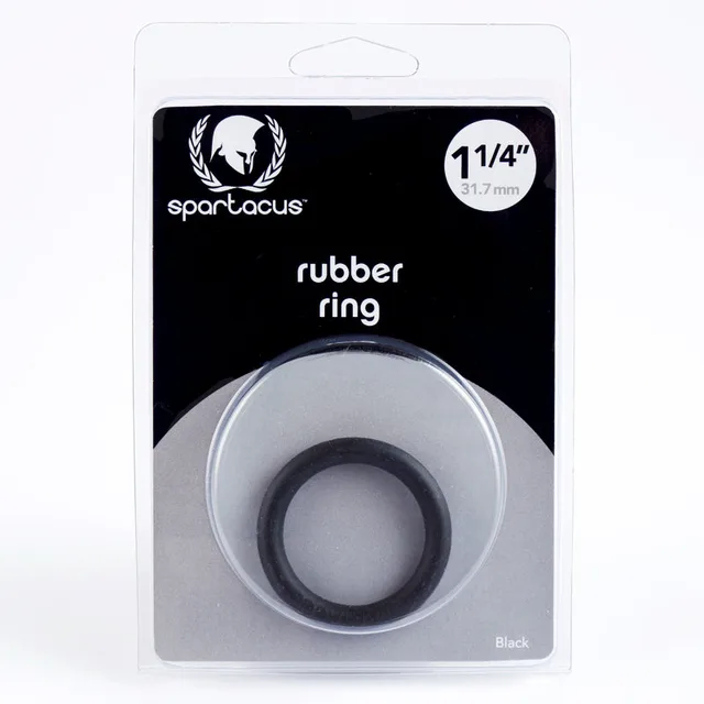Black 1.25-inch Spartacus rubber cock ring in clear black-backed retail packaging