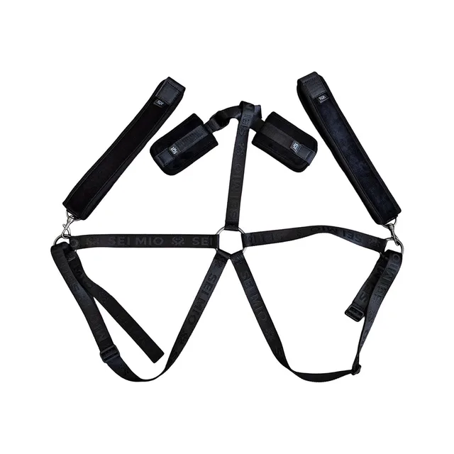 Black adjustable body harness with padded wrist and thigh cuffs