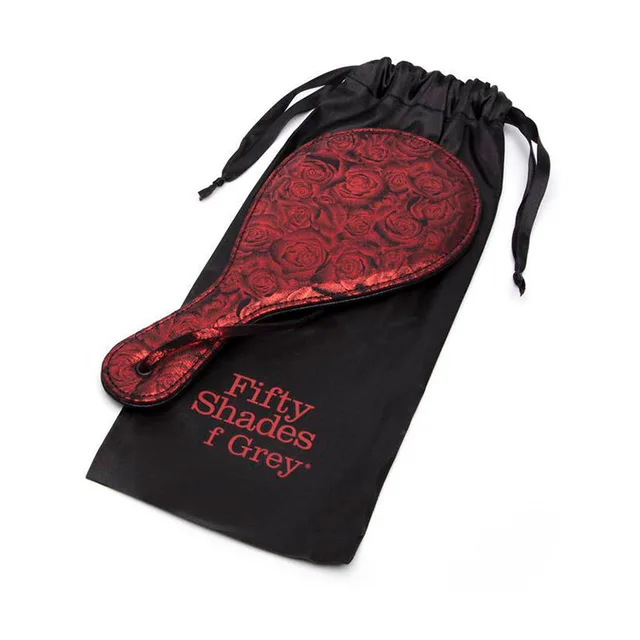 Red rose-pattern Sweet Anticipation round paddle on black storage bag