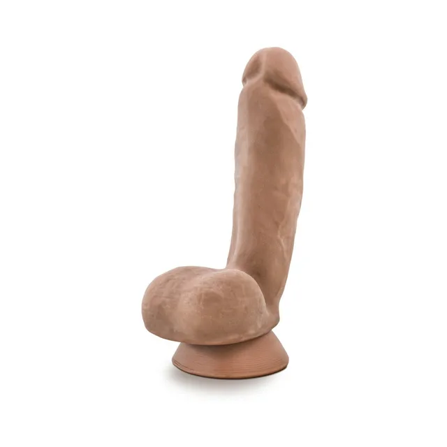 Upright tan Macho dildo with molded shaft and suction base