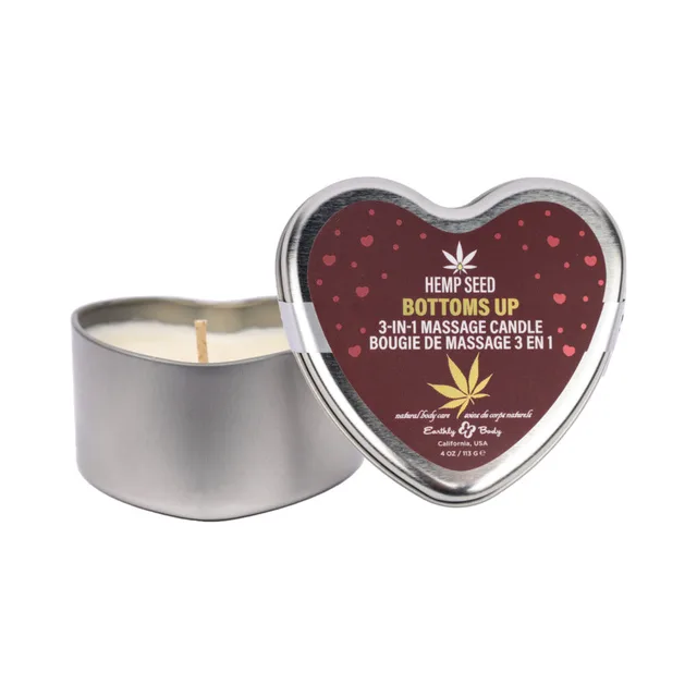 open silver heart tin of Earthly Body Bottoms Up candle beside lid