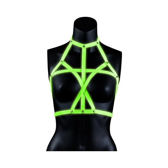 Neon-green geometric bra harness on black mannequin