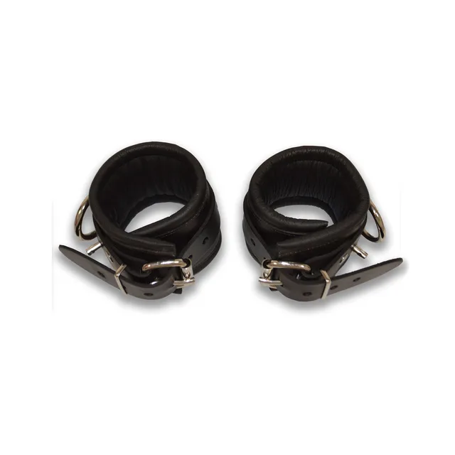 Pair of Prowler RED S/M black ankle cuffs coiled with buckles visible