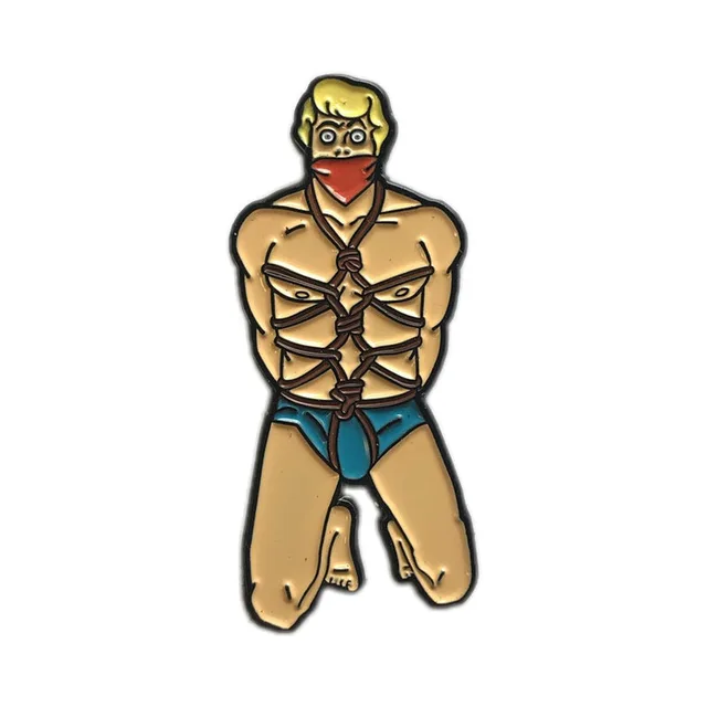 blonde kneeling character enamel pin with rope harness and blue briefs