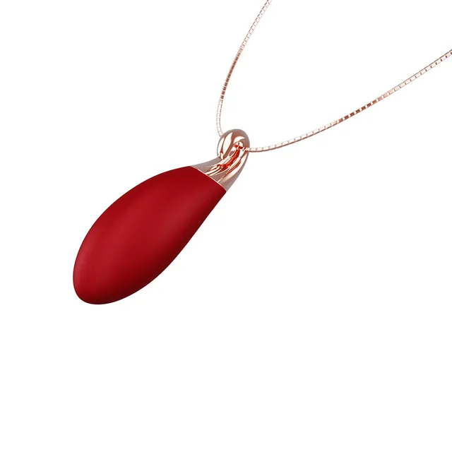 Ruby teardrop pendant hanging from fine rose-gold chain