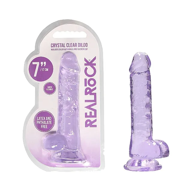 Purple RealRock Crystal Clear 7-inch dildo beside retail pack