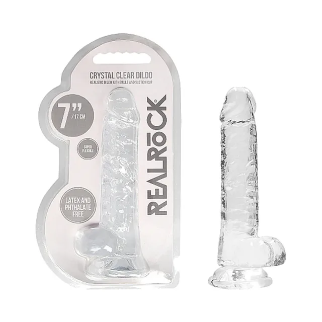 Clear RealRock Crystal Clear 7-inch dildo beside blister pack