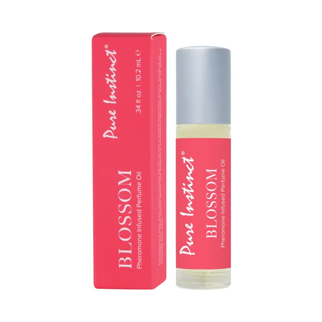 Pure Instinct Blossom perfume roll-on 0.34 oz clear roll-on bottle beside coral carton