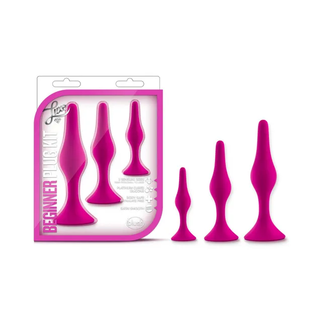 Blush Luxe hot-pink three-piece plug kit beside clear pink-trimmed retail package