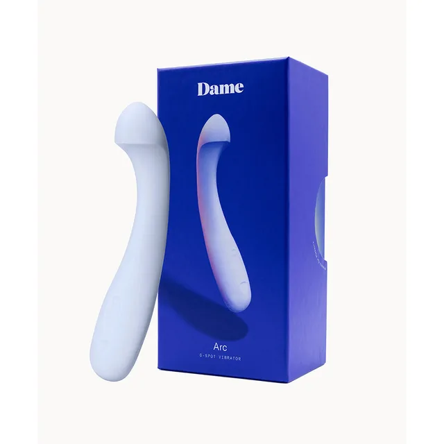 Ice-blue Dame Arc vibrator beside blue retail box