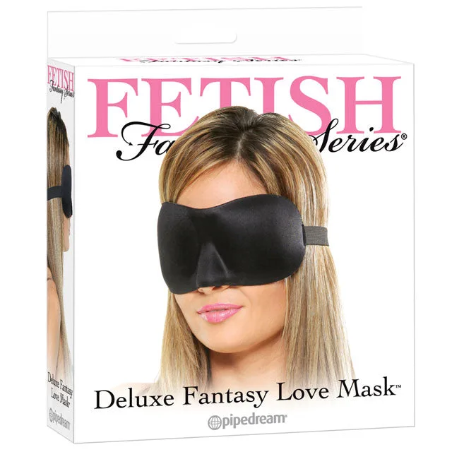 Model wearing black Fetish Fantasy Deluxe Love Mask on retail box