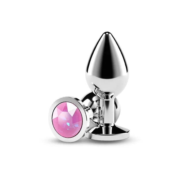 Polished silver medium plug beside round faceted pink gem