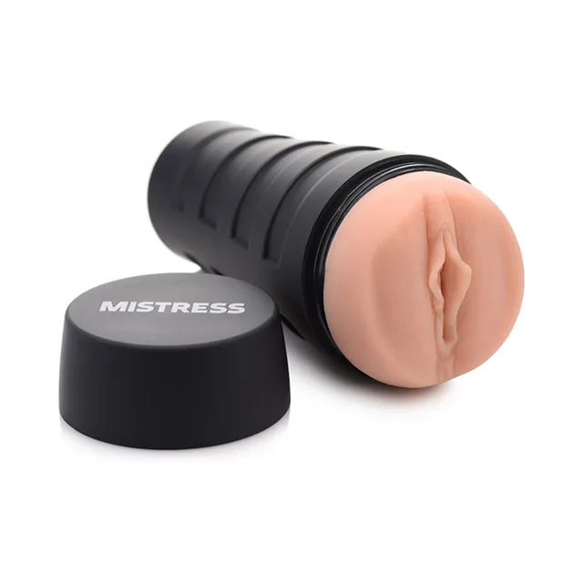 Mistress Sophia stroker beside black ribbed case and round cap