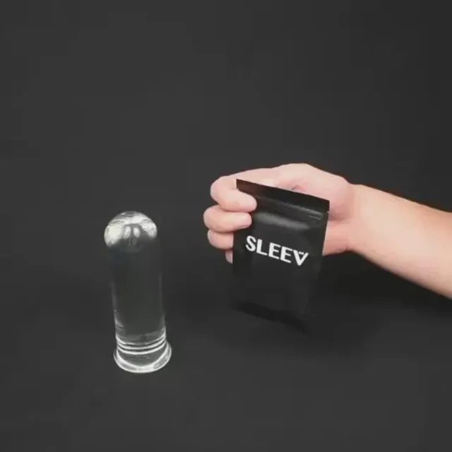 Hand holding black SLEEV pouch beside a clear disposable sleeve