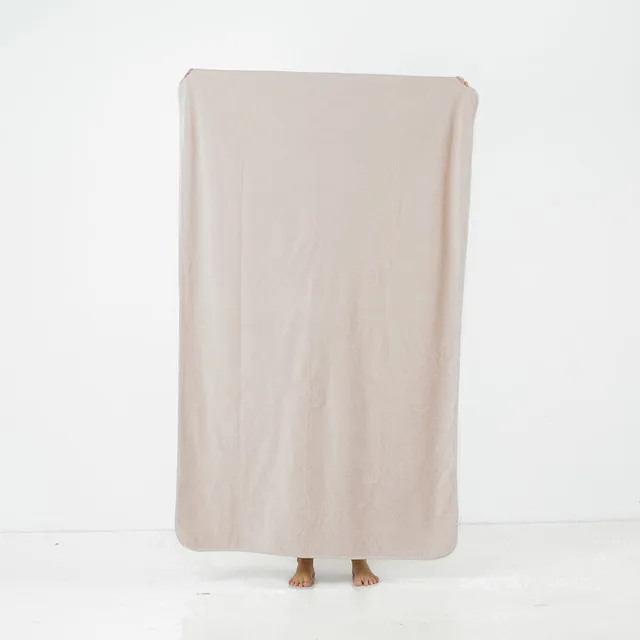 Splash Blanket The OG medium champagne blanket held upright against white background