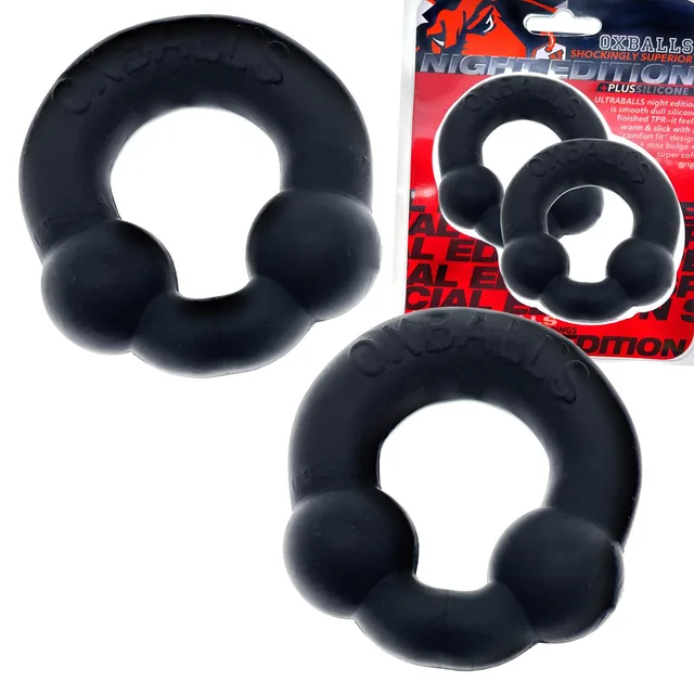 Two OxBalls Ultraballs Night rings beside red retail packaging