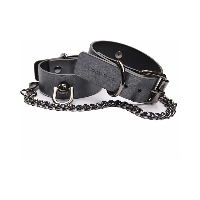 Gray Coquette vegan-leather cuffs stacked beside removable chain