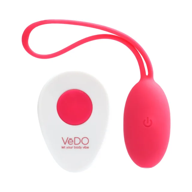 VeDO Peach Foxy Pink Egg Vibrator pink egg beside white oval remote
