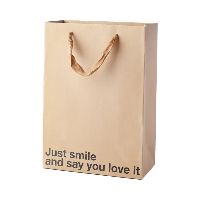 tan kraft gift bag reading Just smile and say you love it
