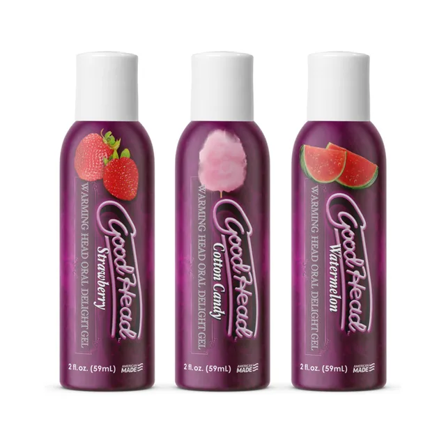 Three purple GoodHead bottles with assorted fruit and candy labels