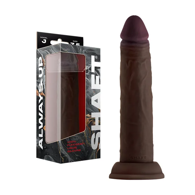 Shaft Model J Mahogany 7.5-inch dildo beside its retail box