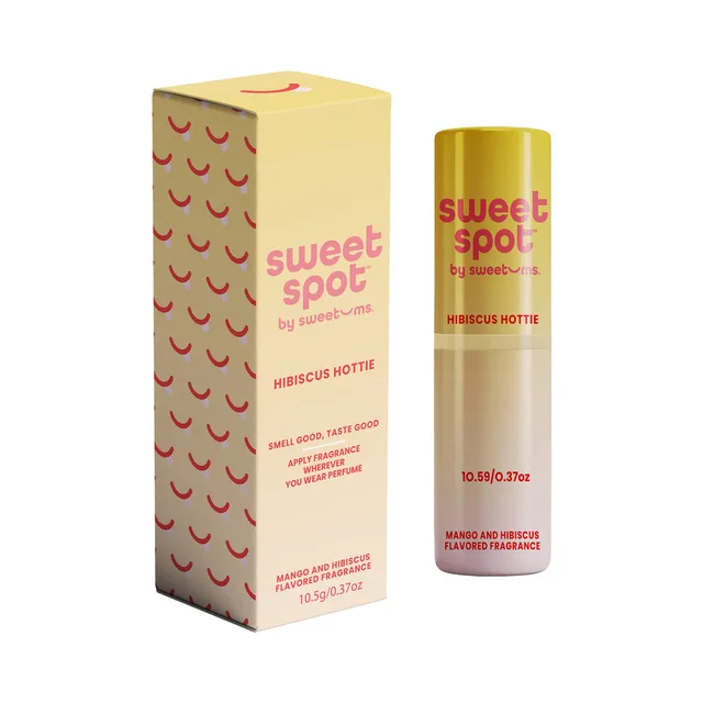 Sweetums Sweet Spot hibiscus hottie flavored fragrance displayed as a yellow tube beside its retail box