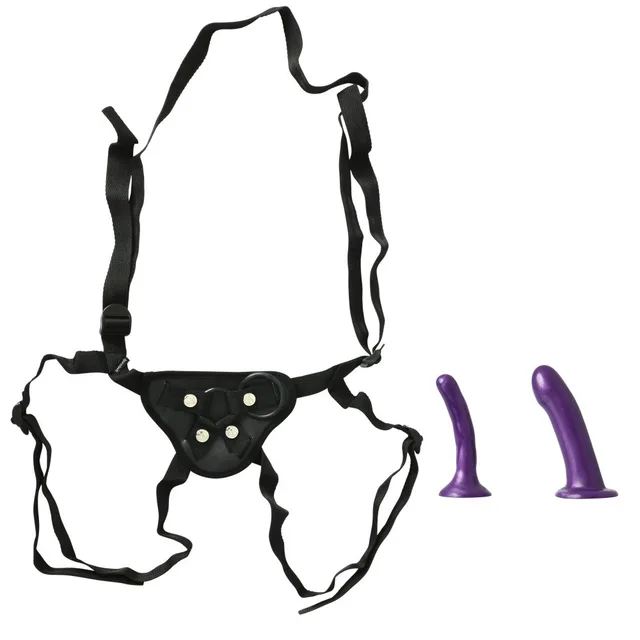 Sportsheets Anal Explorer Harness Kit black webbing harness beside two purple dildos