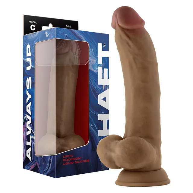 Shaft Model C oak dildo beside blue windowed retail box