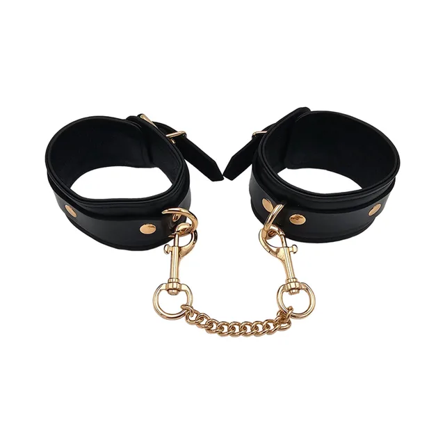 Rouge black leather ankle cuffs with gold hardware open circular view showing the broad bands