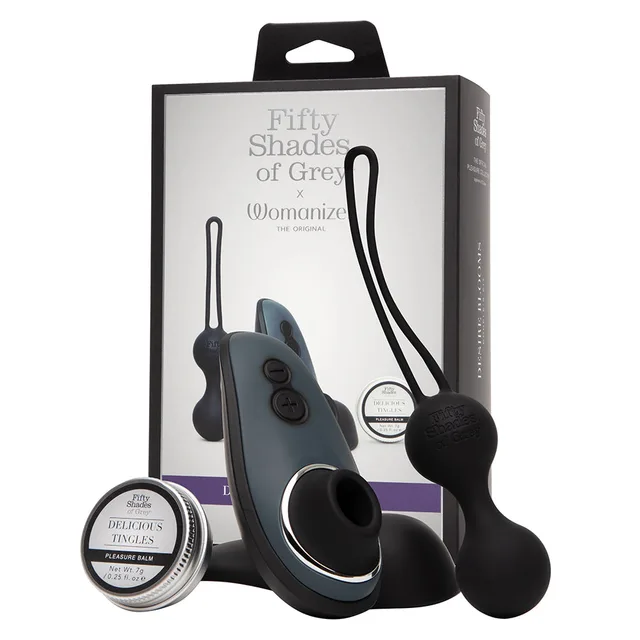 Fifty Shades Womanizer Desire Blooms black two-toy kit beside retail box with Liberty stimulator and Kegel balls