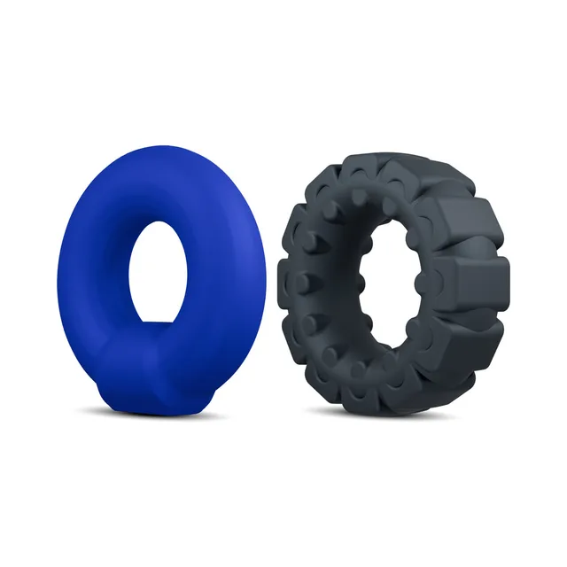 Blue smooth oval ring beside black ridged ring
