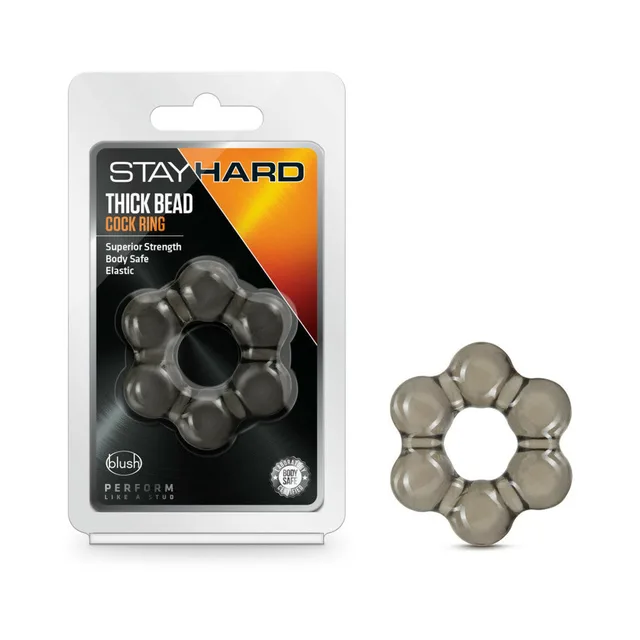 Black Stay Hard thick-bead ring beside retail package