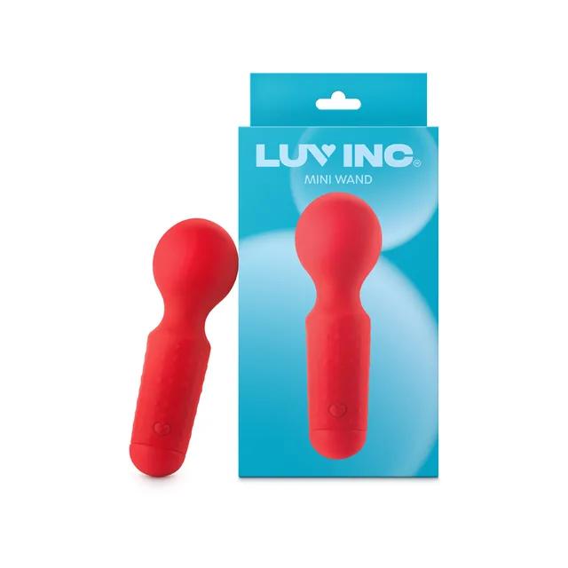 Red Luv Inc MW65 mini wand standing beside blue retail card