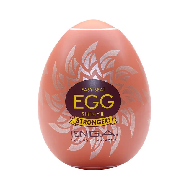 coral Tenga EGG Shiny II case covered with white sunburst graphics