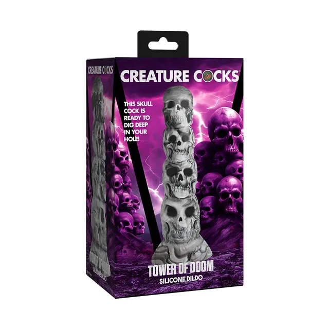 Creature Cocks Tower of Doom gray stacked-skull dildo pictured in purple skull retail box