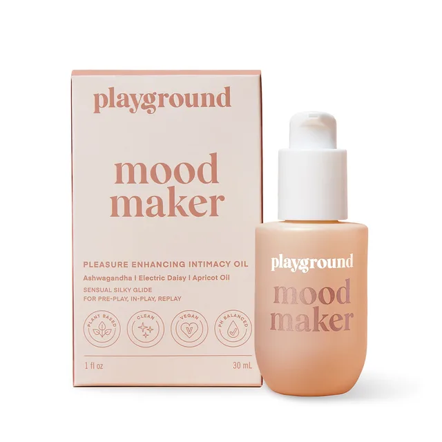 Playground Mood Maker 1 fl oz pump bottle beside peach botanical oil carton