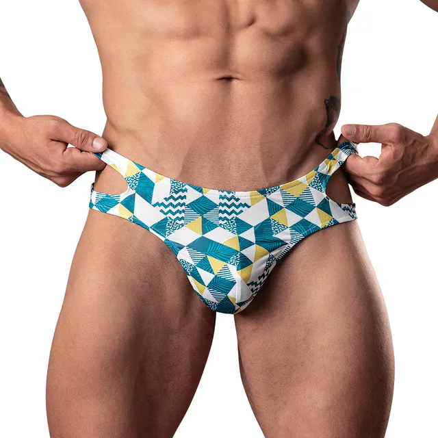 Male Power Cut It Out S/M blue geometric cutout thong close front view worn by model