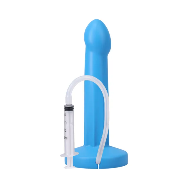Lagoon POP dildo beside connected graduated syringe