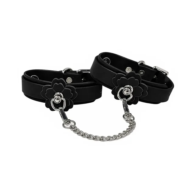 Pink Elephant Heat Tease black and pink flower cuffs with chain black cuff pair with layered flowers and silver-tone chain