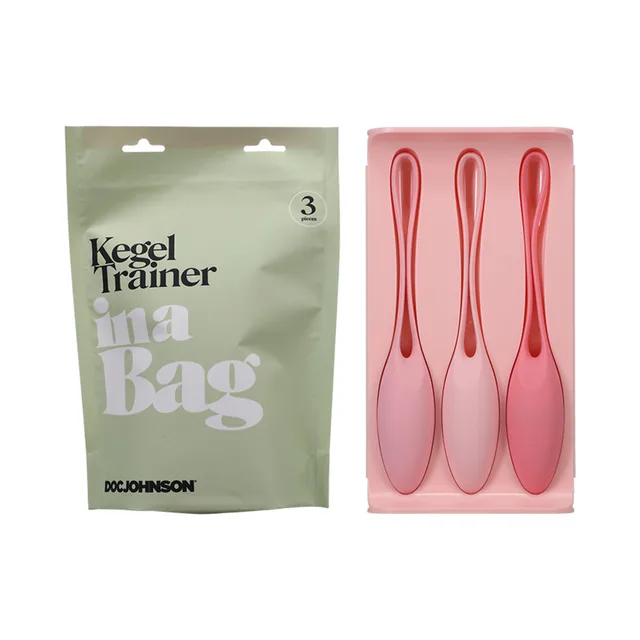 Three pink silicone kegel trainers beside green In a Bag pouch