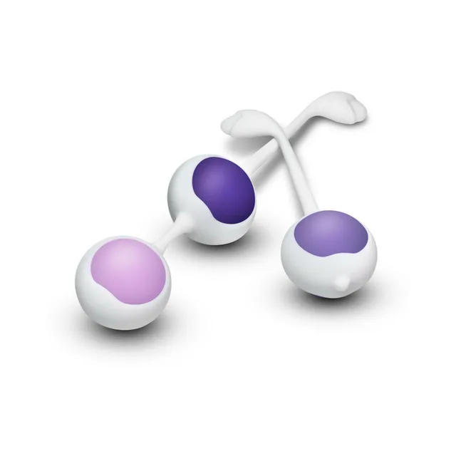 Three Blush Wellness purple Kegel ball weights in white holders