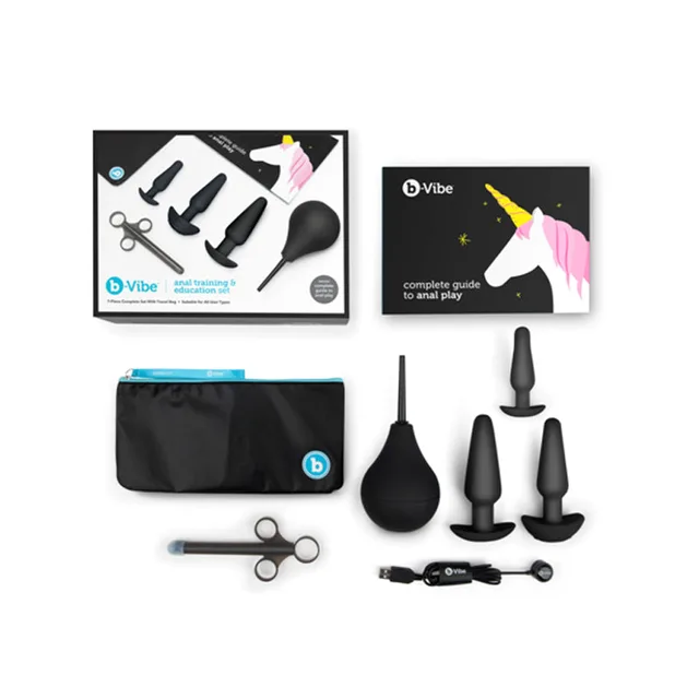 Black b-Vibe anal training set arranged beside box pouch and guide
