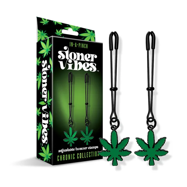 Stoner Vibes tweezer clamps and green charms beside retail box