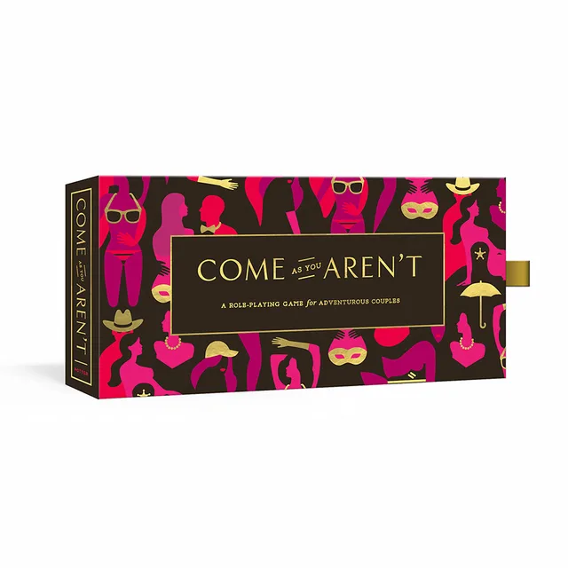 pink and black Come As You Aren't roleplaying game box with gold title panel