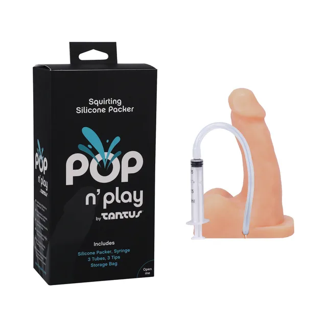 Tantus POP n' Play cream dildo with syringe beside black box
